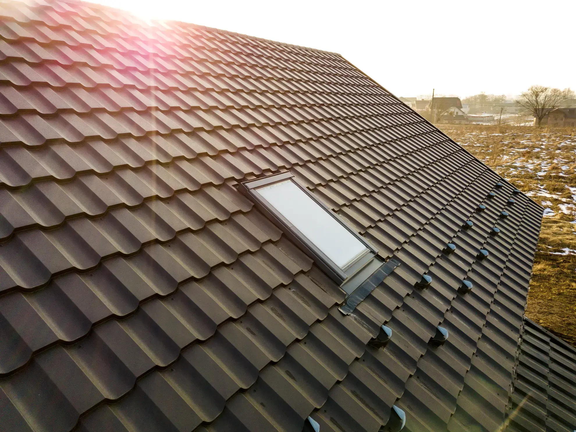 Roofing contractor in New Hampshire installing asphalt shingles